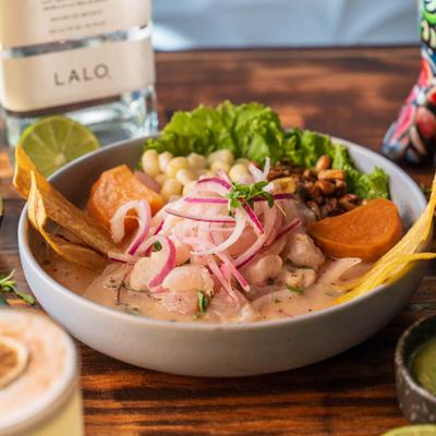 Peruvian ceviche features fresh raw fish cured in citrus juice with red onions.