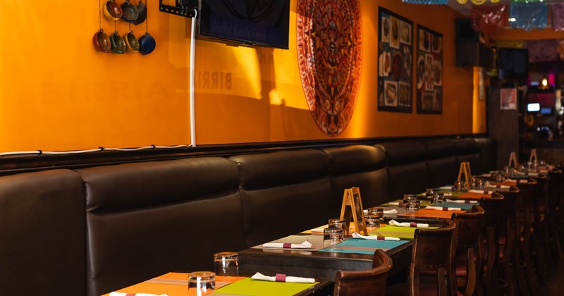 Interior, banquette seating with tables and chairs
