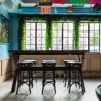 Interior, seating area, tall table and chairs.