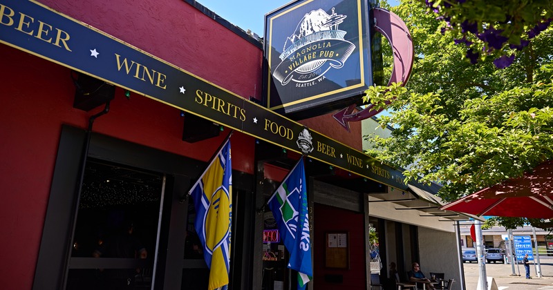 Exterior, angle view to entrance, flag and sign above