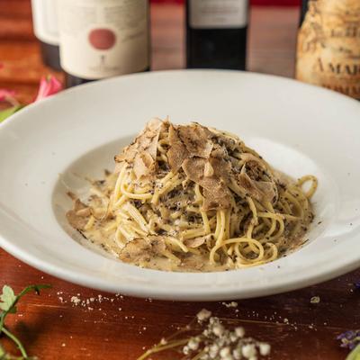 A plate holds creamy mushroom pasta.