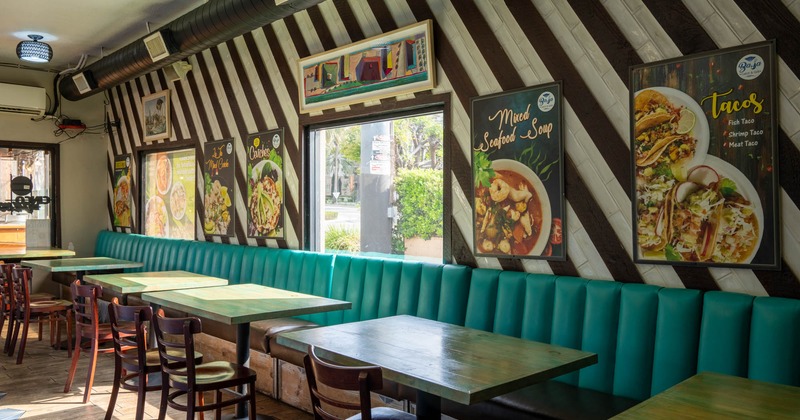 Interior, tables, chairs and long high back bench