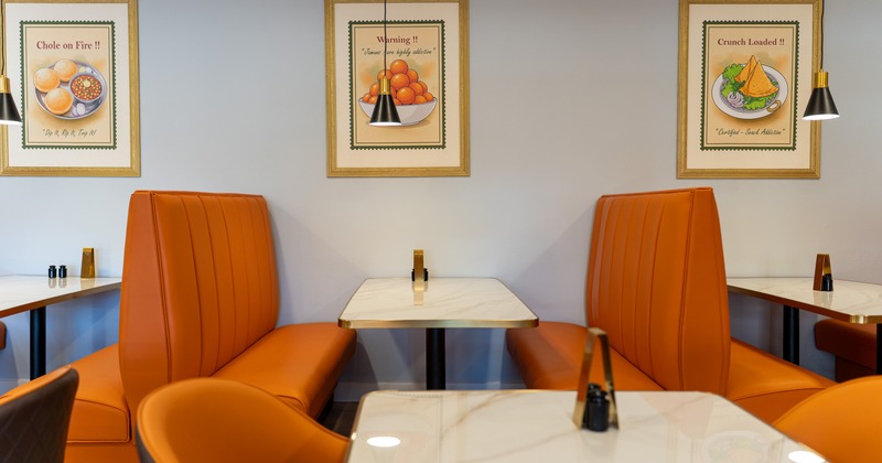 Interior, seating booths and tables, art on the wall