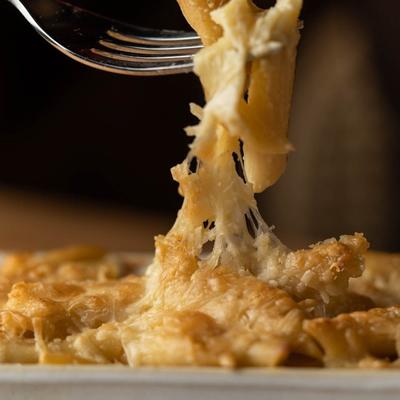 A fork stuck into food.