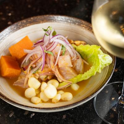 Ceviche with fish, corn, onion, and sweet potato.