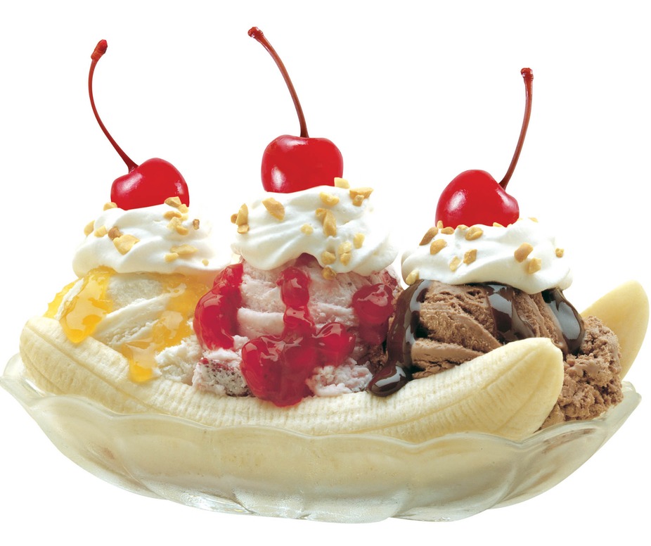 Banana split topped with ice cream, sauces, whipped cream and cherries.