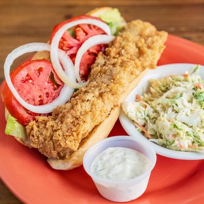 Asian Grouper sandwich served with coleslaw and dressing.