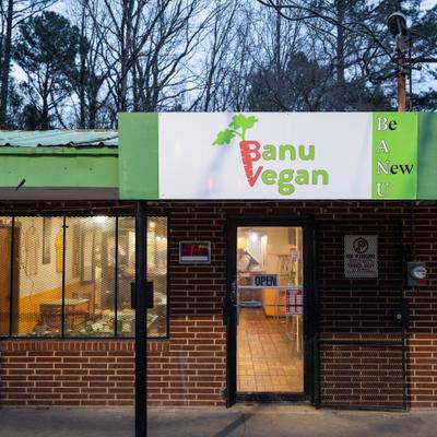 Storefront, entrance with a sign.