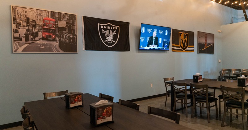 Various pictures and team flags on wall