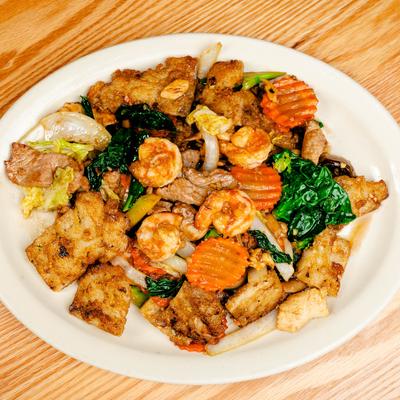 Pan fried rice noodles with broccoli, mushrooms, napa cabbage, carrots, and onion.