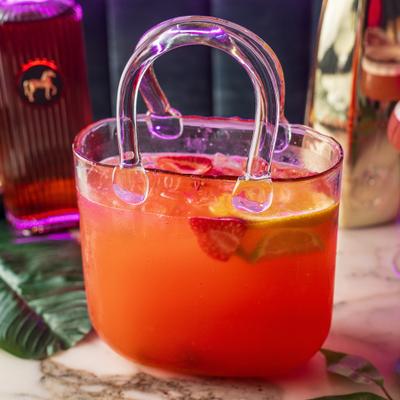 Mimosa in a handbag shaped glass.