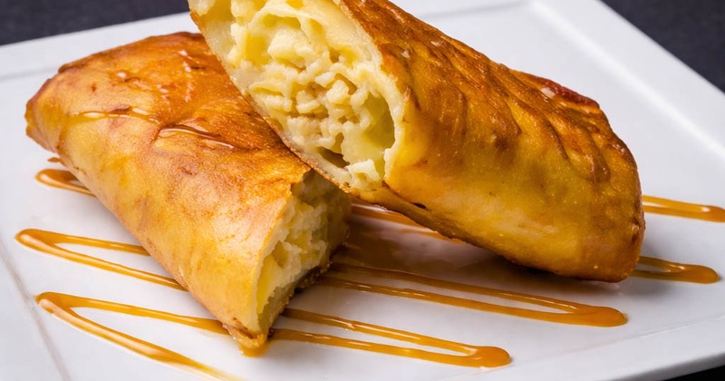 Fried cheesecake chimichanga drizzled with caramel sauce