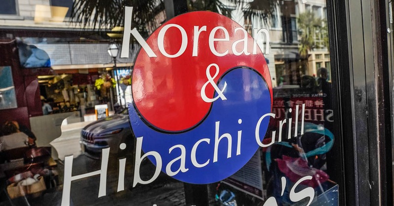 Exterior, restaurant's name and logo on a window