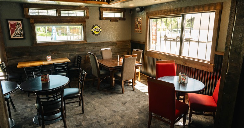 Interior of a rustic-style restaurant with wooden tables