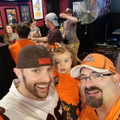 Fans in orange jerseys selfie