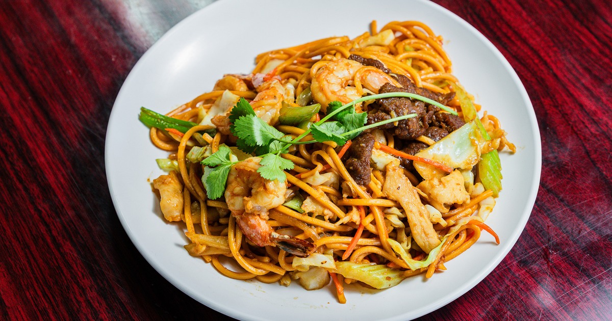 Noodle stir-fry with shrimp, beef, and vegetables