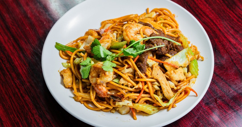 Noodle stir-fry with shrimp, beef, and vegetables