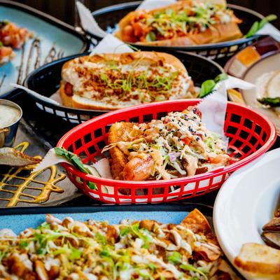 Multiple food plates displayed on a table.