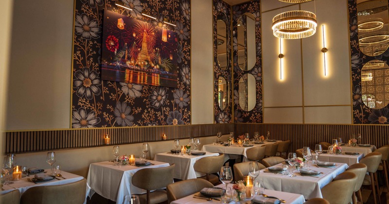 Interior, dining area, white cloth tables, ready for guests, floral wallpapers