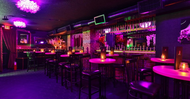 Bar area, tables and chairs, mirrors on the wall