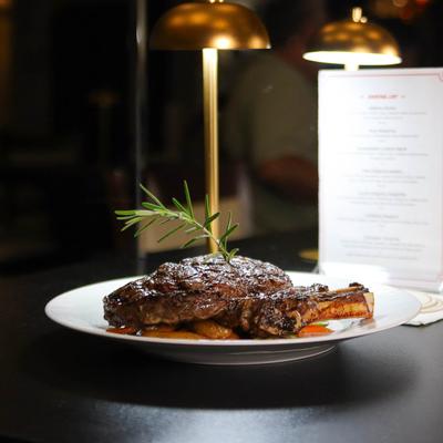 Grilled bone in ribeye steak.