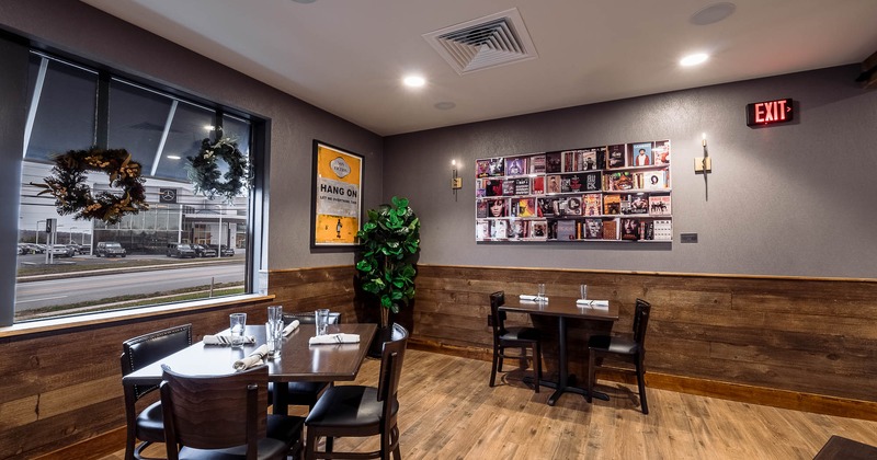 Interior, two tables with chairs for four with tableware