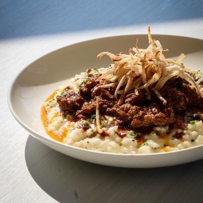 Creamy risotto topped with slow-cooked shredded beef and crispy shoestring onions.