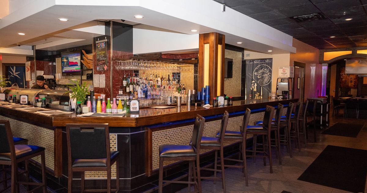 Interior, bar area, wooden top bar with stools