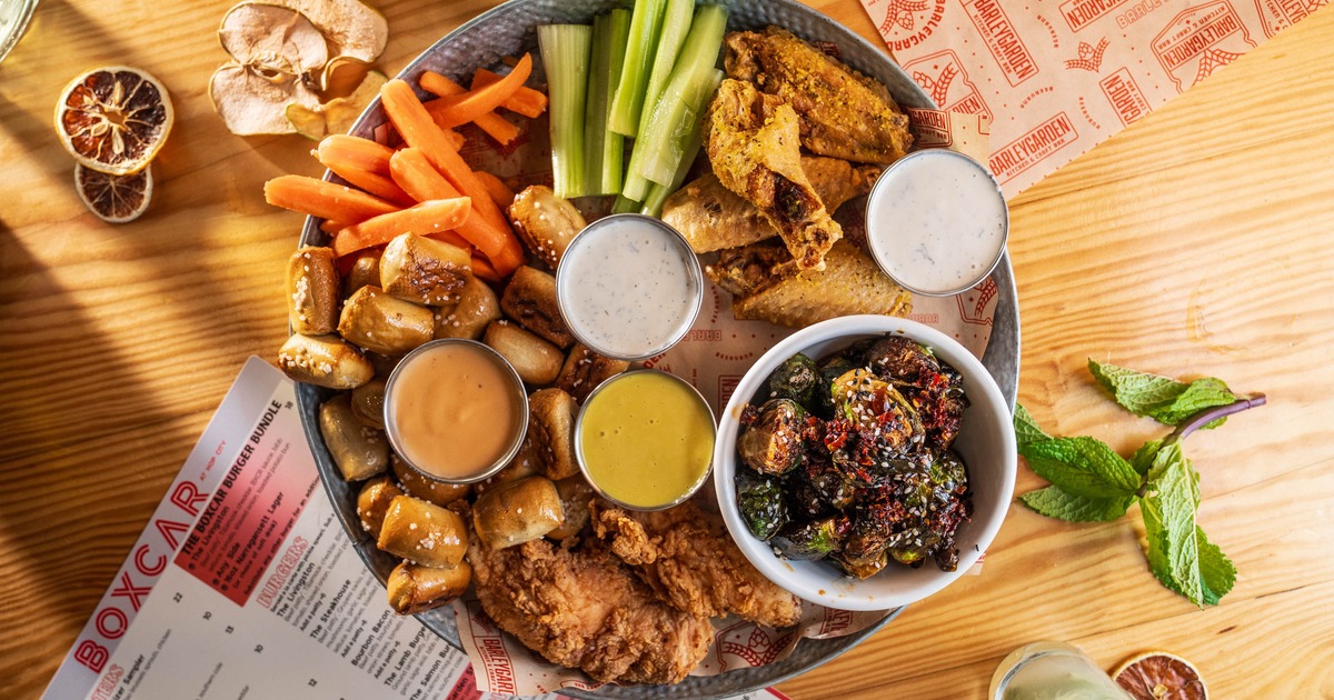 Appetizer Sampler with pretzel bites, chicken tenders wings, Brussels sprouts and veggie sticks