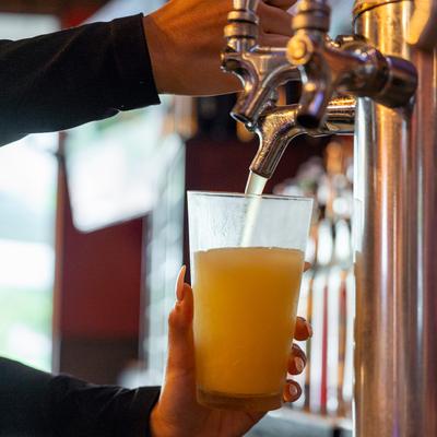 Pouring beer from the tap.