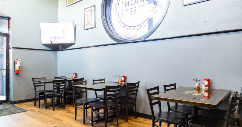 Interior, raw of dining tables by a wall