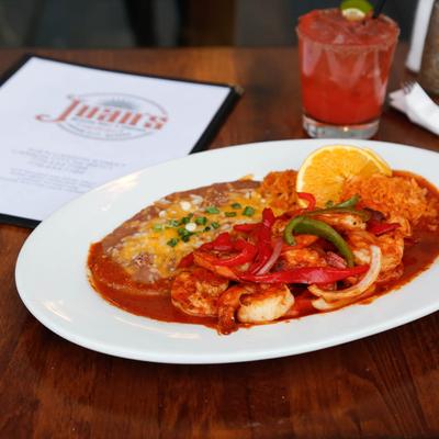 Shrimp Mariscos, sauteed with fresh chiles and red onions in Fuego sauce.