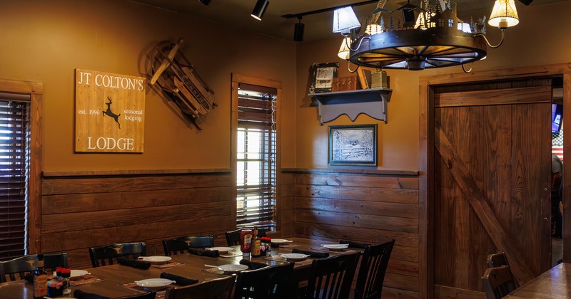 Interior, wooden-panel walls, tables and chairs, chandelier