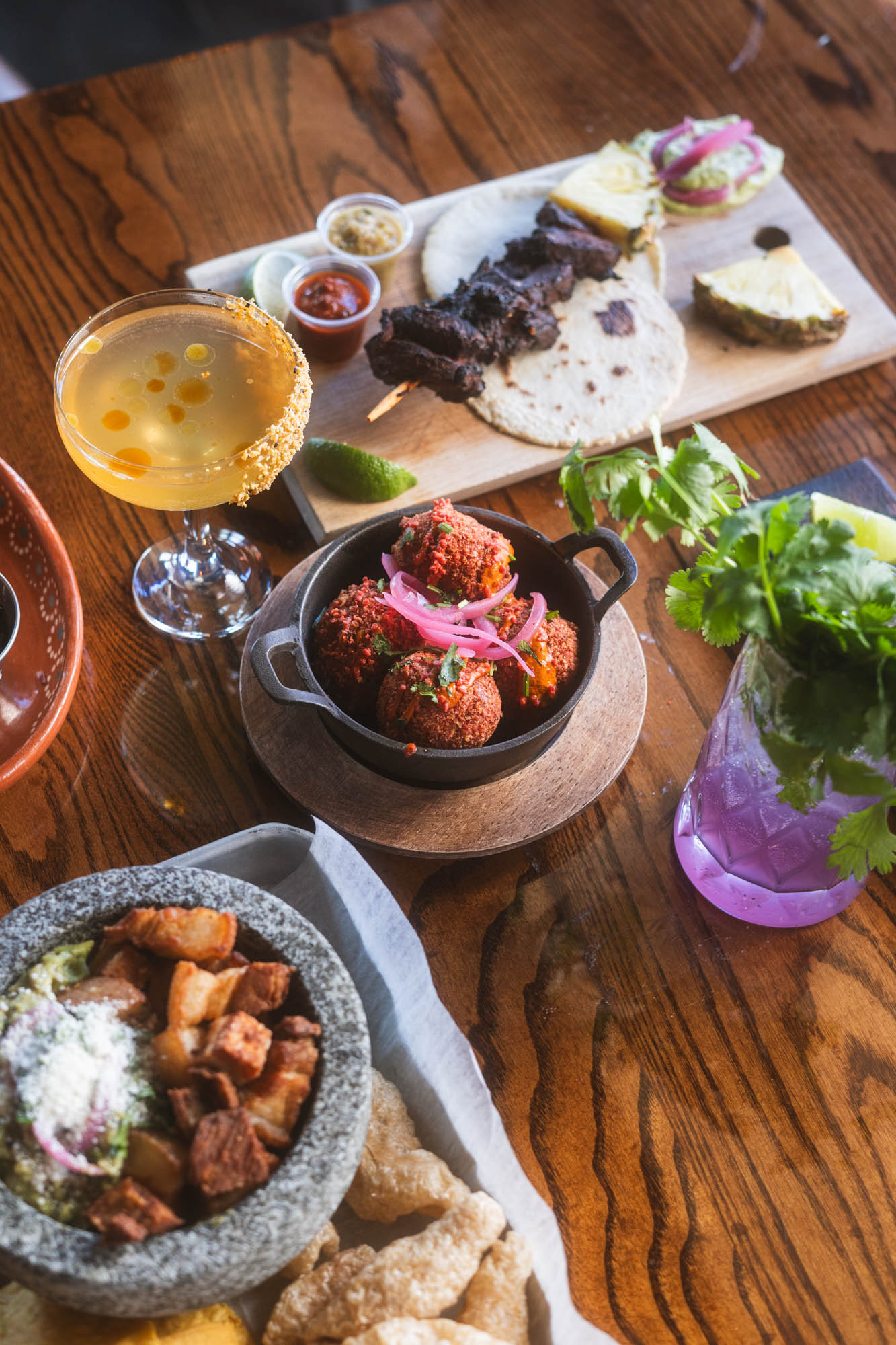 Various dishes and cocktails on a table