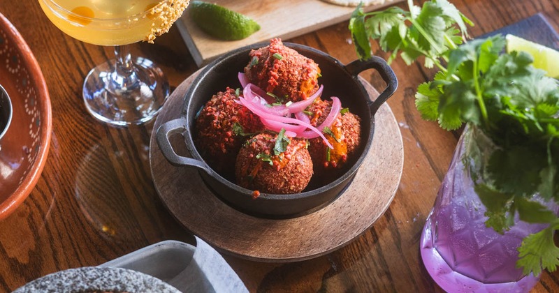 Various dishes and cocktails on a table