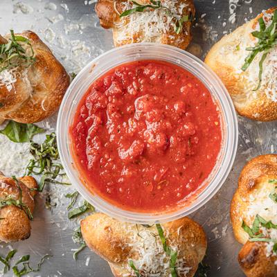 Garlic Knots with a side of pizza sauce.