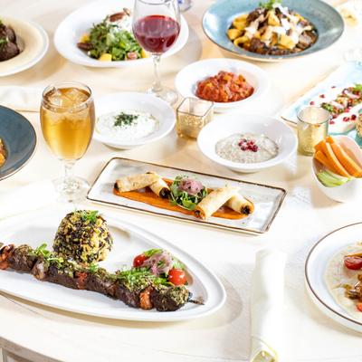Assorted dishes and drinks served on a table.