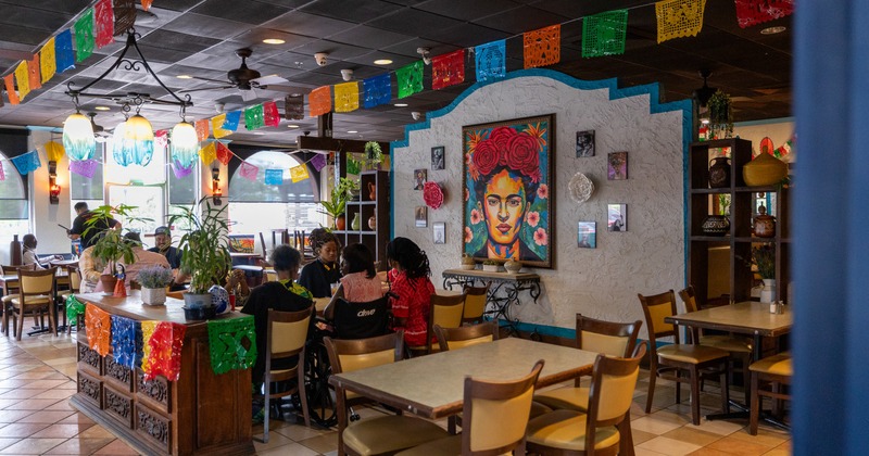 Interior, dining space with Frida Kahlo painting