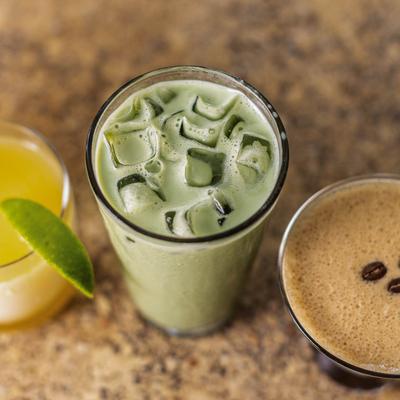 Close up view of a Frozen Margarita, iced Matcha Latte, and espresso martini.