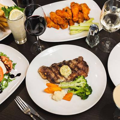 Ribeye steak and other dishes served