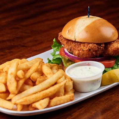 Deep fried catfish sandwich and fries.