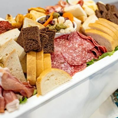 Charcuterie platter with bread and sliced meats.