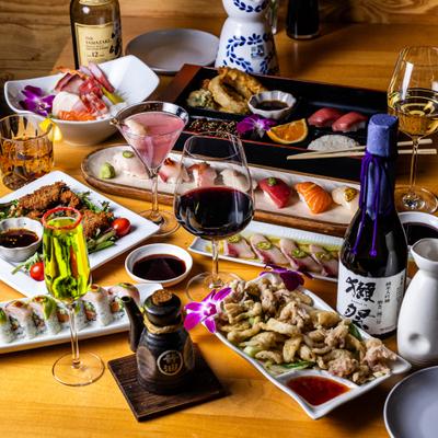 Colorful table spread of of Japanese dishes and drinks.
