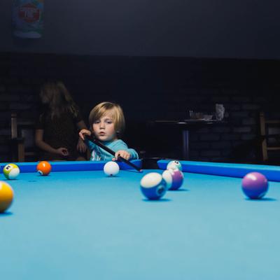 A child playing pool.