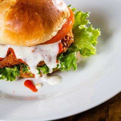 Buffalo chicken sandwich with lettuce, tomato and ranch
