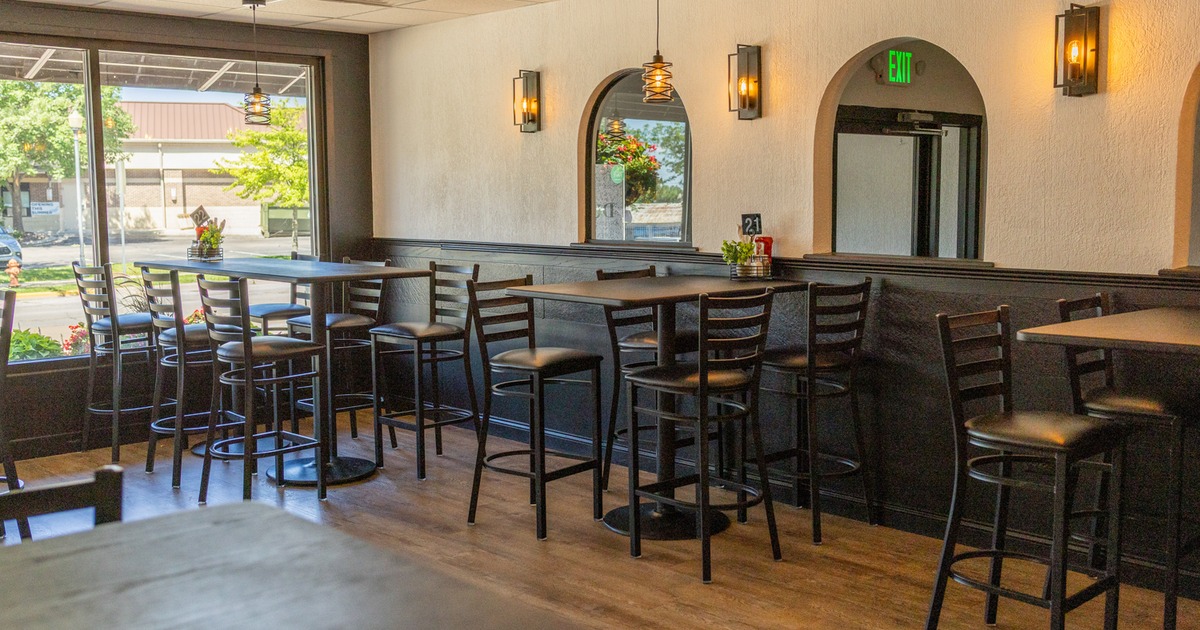 Interior, seating area with bar tables and stools