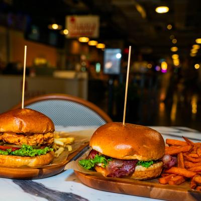 Fried chicken sandwich with French fries and the Hoos burger with sweet potato fries.