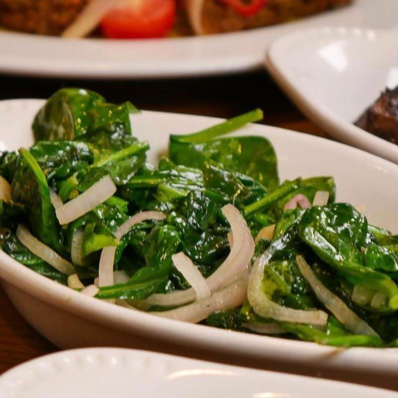 Sautéed spinach with onion, garlic & lemon juice photo