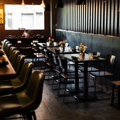 Interior, diner area, tables, chairs, wide view.