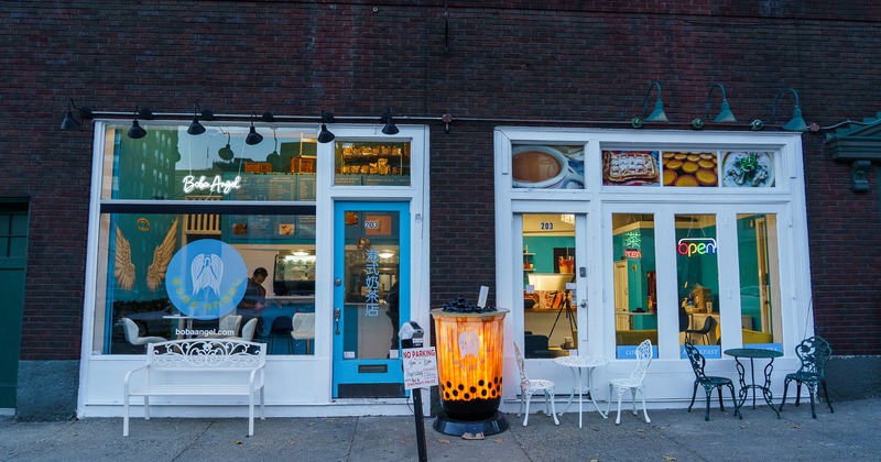 Exterior, tables and chairs in front of the entrance